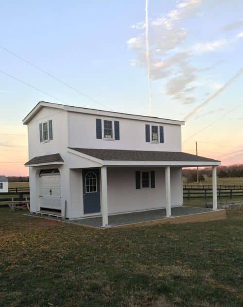 Two-story single wide Amish-built garage at sunset